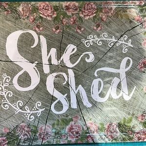 She shed sign